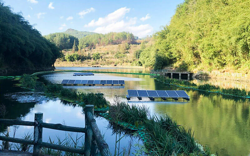 various water pumps with solar panels in background